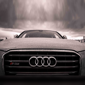 A gray image of an Audi car